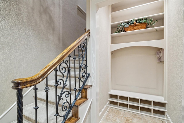 6 Kings Lake Estates Blvd, Kingwood, TX 77346 - stairs with a textured wall and baseboards