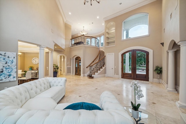 6 Kings Lake Estates Blvd, Kingwood, TX 77346 - entrance foyer featuring a towering ceiling, arched walkways, crown molding, stairs, and recessed lighting