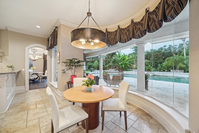 6 Kings Lake Estates Blvd, Kingwood, TX 77346 - dining area featuring stone tile floors, a chandelier, ornamental molding, and recessed lighting
