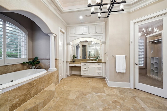6 Kings Lake Estates Blvd, Kingwood, TX 77346 - full bath featuring ornate columns, ornamental molding, vanity, a tub with jets, and a chandelier
