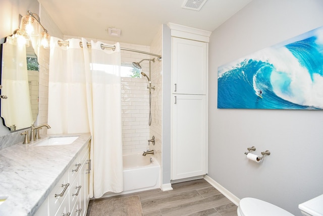 327 Cinnamon Oak Ln, Houston, TX 77079 - bathroom featuring vanity, shower / bath combination with curtain, and wood finished floors