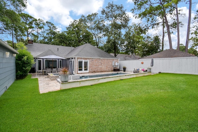 327 Cinnamon Oak Ln, Houston, TX 77079 - rear view of property featuring a patio area, brick siding, a fenced backyard, and a shingled roof