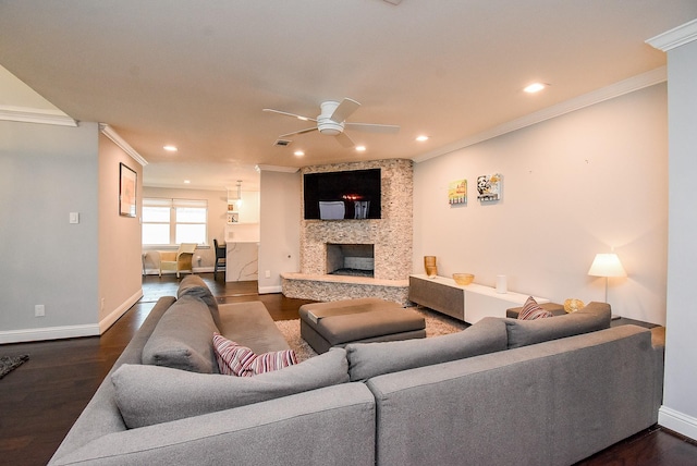 327 Cinnamon Oak Ln, Houston, TX 77079 - living area with crown molding, a ceiling fan, dark wood-style flooring, recessed lighting, and a fireplace
