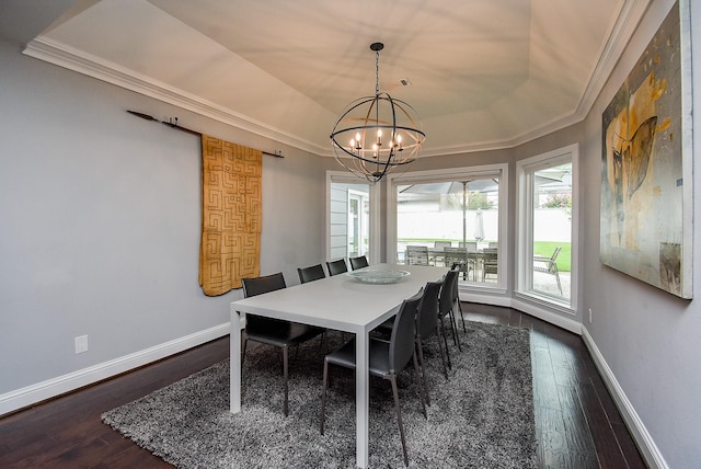 327 Cinnamon Oak Ln, Houston, TX 77079 - dining area with a chandelier, crown molding, dark wood-style flooring, and a tray ceiling