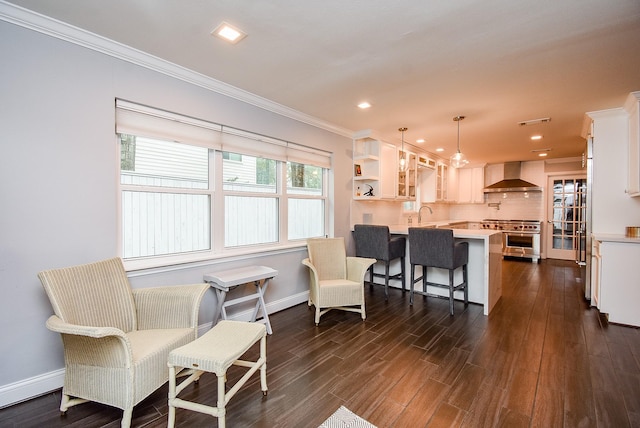 327 Cinnamon Oak Ln, Houston, TX 77079 - living room with crown molding, dark wood finished floors, and recessed lighting