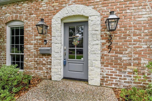 327 Cinnamon Oak Ln, Houston, TX 77079 - doorway to property with brick siding