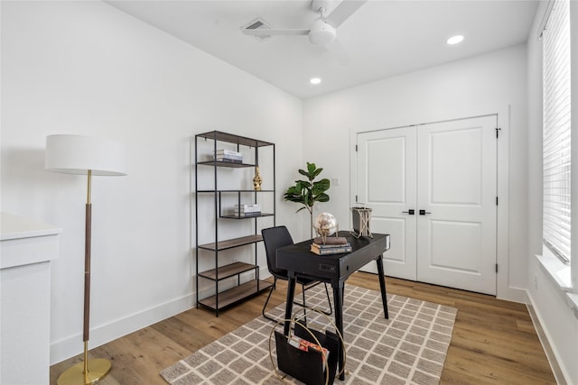 3219 Brewster St, Houston, TX 77026 - home office featuring a ceiling fan, wood finished floors, and recessed lighting
