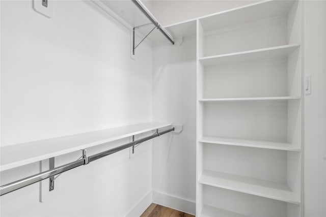3219 Brewster St, Houston, TX 77026 - walk in closet with wood finished floors