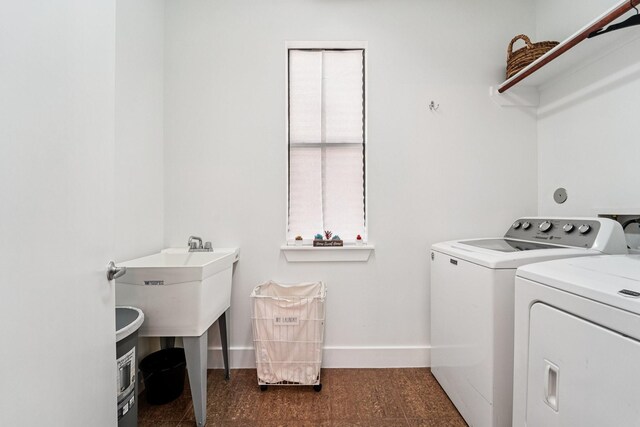 2209 Bastrop St, Houston, TX 77003 - laundry area with washer and dryer and baseboards