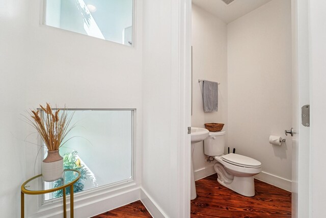 2209 Bastrop St, Houston, TX 77003 - half bath featuring wood finished floors and toilet