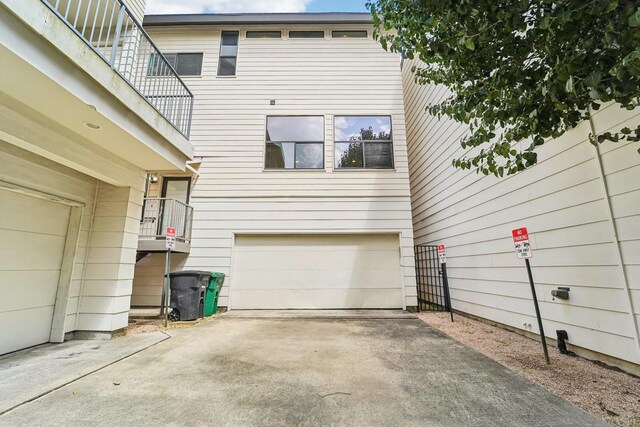 2209 Bastrop St, Houston, TX 77003 - back of property featuring a garage and concrete driveway