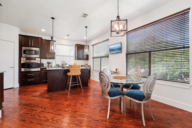 2209 Bastrop St, Houston, TX 77003 - dining room with a chandelier, dark wood finished floors, and recessed lighting