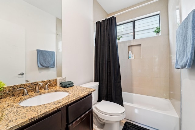 2209 Bastrop St, Houston, TX 77003 - kitchen with appliances with stainless steel finishes, a center island, dark brown cabinets, dark wood-style floors, and light stone countertops