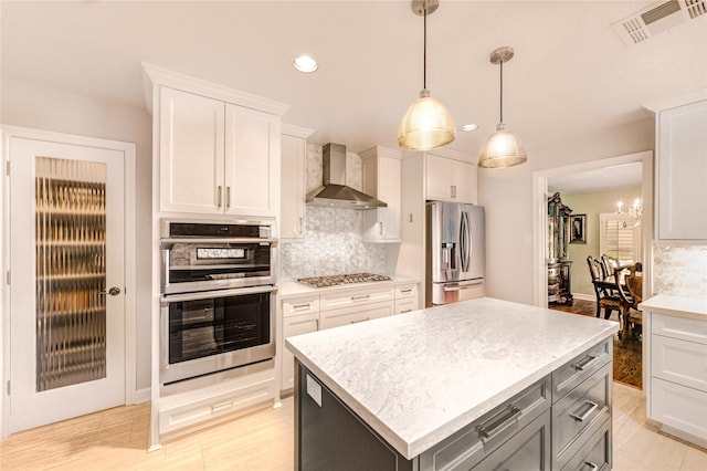 15817 Honolulu St, Jersey Village, TX 77040 - kitchen with stainless steel appliances, wall chimney range hood, recessed lighting, light countertops, and backsplash