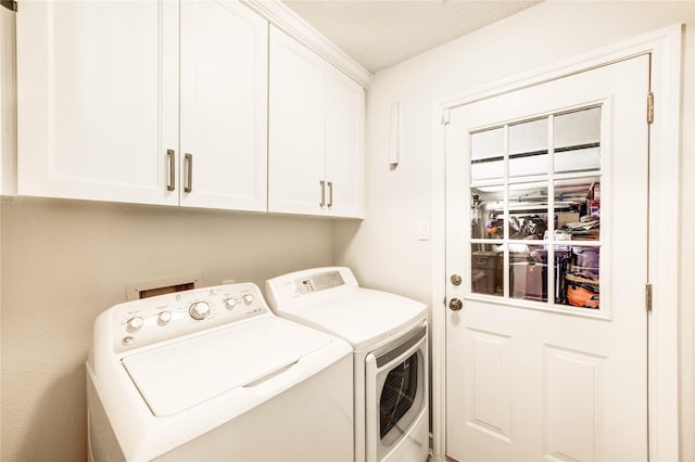 15817 Honolulu St, Jersey Village, TX 77040 - laundry area featuring washer and clothes dryer and cabinet space