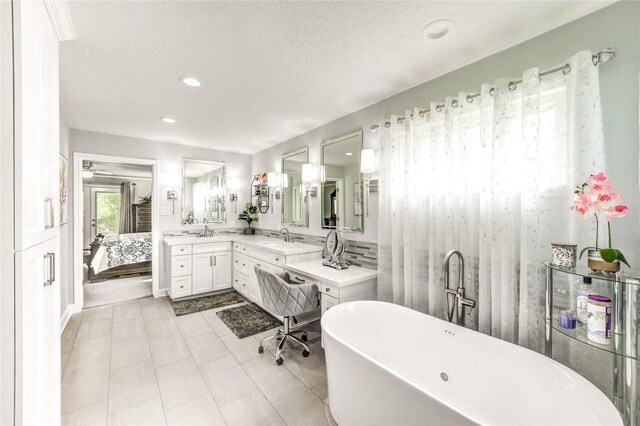 15817 Honolulu St, Jersey Village, TX 77040 - bathroom with a freestanding bath, vanity, recessed lighting, ensuite bath, and tile patterned floors