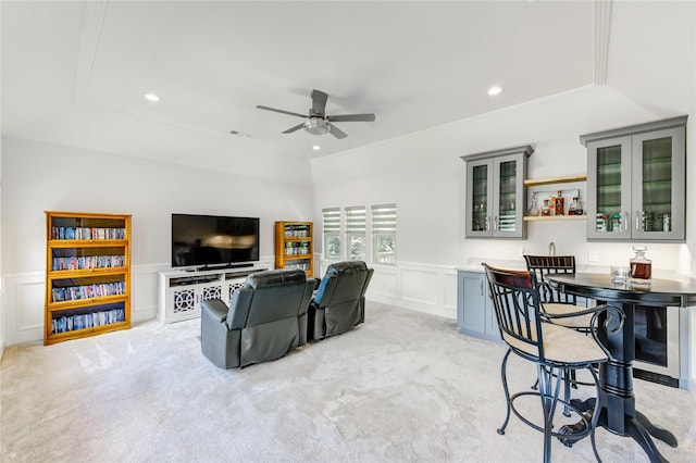 15817 Honolulu St, Jersey Village, TX 77040 - living area with a ceiling fan, light carpet, a decorative wall, a wainscoted wall, and recessed lighting