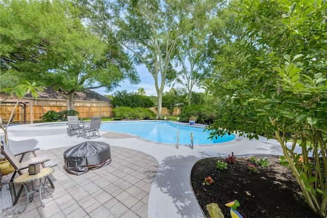 15817 Honolulu St, Jersey Village, TX 77040 - view of pool with a fenced backyard, a fire pit, and a patio