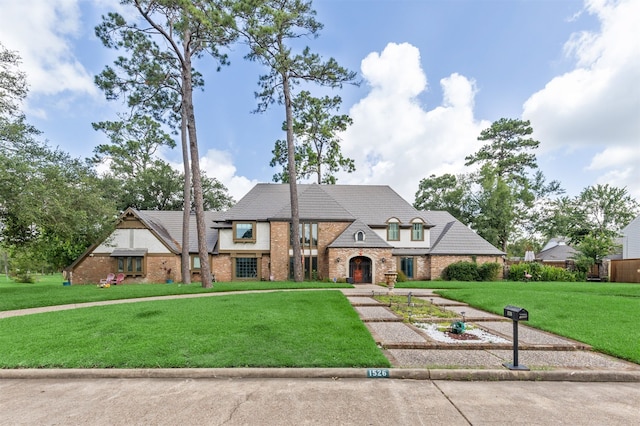 1526 Sweet Grass Trl, Houston, TX 77090 - view of front of home featuring a front lawn and brick siding