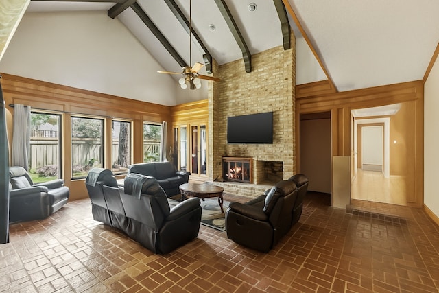 1526 Sweet Grass Trl, Houston, TX 77090 - living room featuring high vaulted ceiling, brick floors, a ceiling fan, beam ceiling, and a brick fireplace