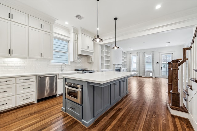 727 Tulane St, Houston, TX 77007 - kitchen featuring gray cabinetry, stainless steel appliances, white cabinetry, open floor plan, and light countertops