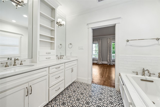 727 Tulane St, Houston, TX 77007 - bathroom with ornamental molding, double vanity, and a bath