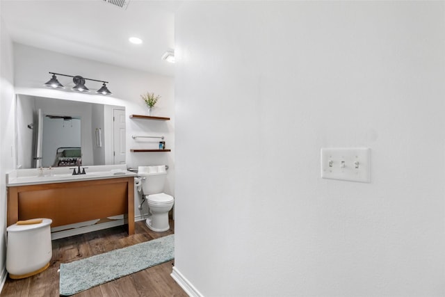 605 Waco St, Dayton, TX 77535 - bathroom featuring vanity and wood finished floors
