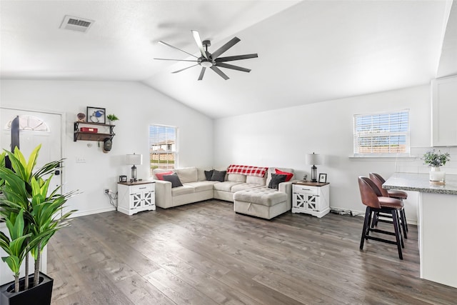 605 Waco St, Dayton, TX 77535 - living room featuring vaulted ceiling, a ceiling fan, healthy amount of natural light, and dark wood-style floors