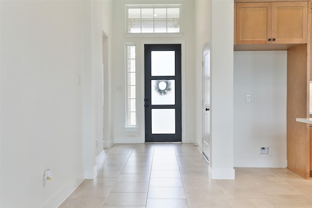 24526 Bluestar Blossom Trl, Katy, TX 77493 - foyer with light tile patterned floors, plenty of natural light, and a high ceiling