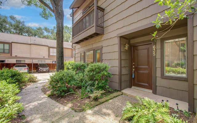 11711 Memorial Dr Unit 635, Houston, TX 77024 - view of exterior entry featuring a balcony