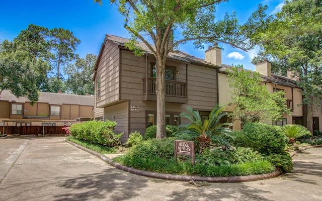 11711 Memorial Dr Unit 635, Houston, TX 77024 - view of side of property featuring a chimney
