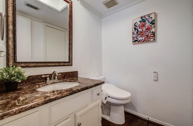 11711 Memorial Dr Unit 635, Houston, TX 77024 - half bathroom featuring vanity, crown molding, and wood finished floors