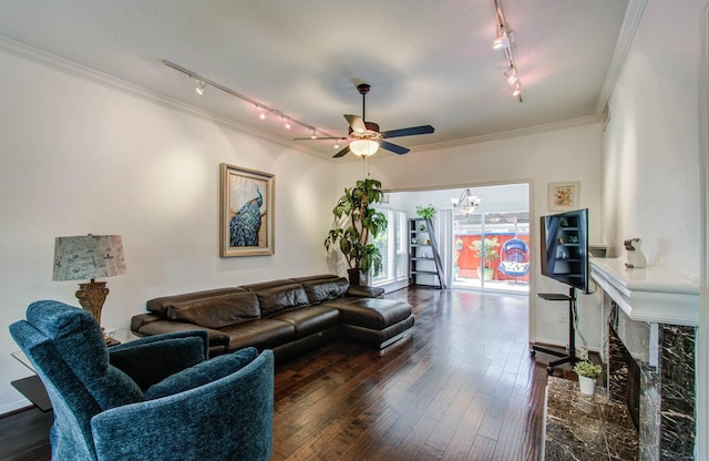 11711 Memorial Dr Unit 635, Houston, TX 77024 - living area featuring track lighting, ornamental molding, a premium fireplace, ceiling fan, and a chandelier