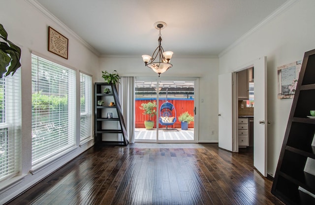 11711 Memorial Dr Unit 635, Houston, TX 77024 - unfurnished dining area with dark wood finished floors, a chandelier, and crown molding
