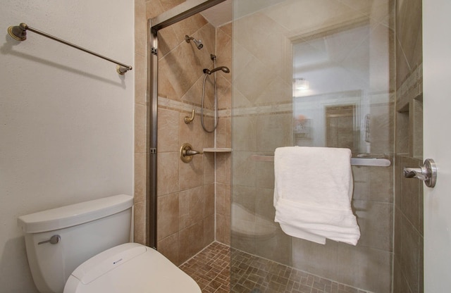 11711 Memorial Dr Unit 635, Houston, TX 77024 - bathroom featuring toilet and a tile shower