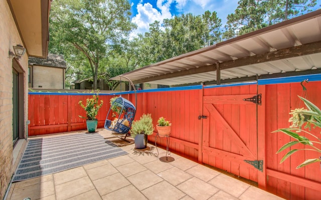11711 Memorial Dr Unit 635, Houston, TX 77024 - view of patio / terrace with a gate