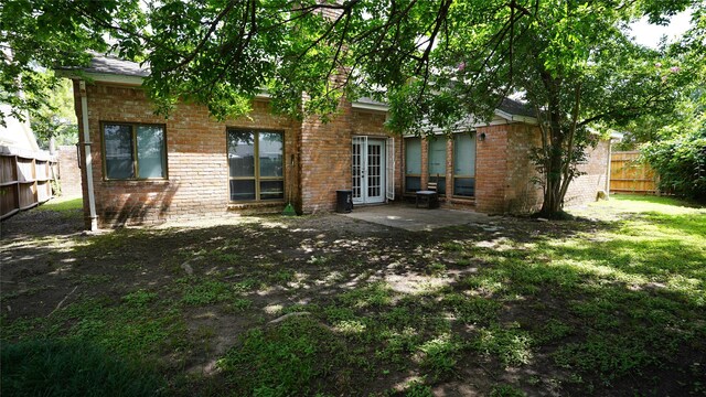 6303 Greenway Forest Ln, Houston, TX 77088 - rear view of house with french doors, a patio, and brick siding