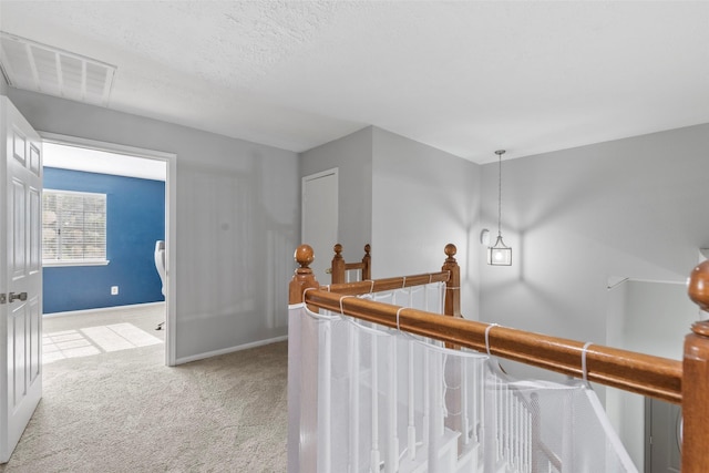 902 Mulberry Ridge Way, Houston, TX 77062 - hallway featuring light carpet and an upstairs landing