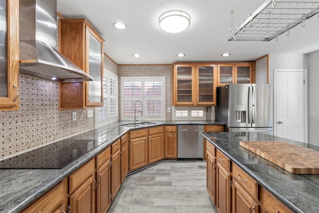902 Mulberry Ridge Way, Houston, TX 77062 - kitchen featuring stainless steel appliances, wall chimney exhaust hood, brown cabinetry, dark stone countertops, and recessed lighting