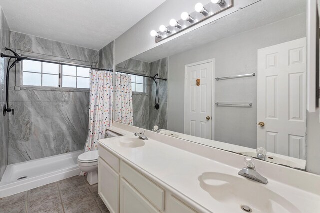 902 Mulberry Ridge Way, Houston, TX 77062 - full bath featuring tiled shower, double vanity, and tile patterned floors