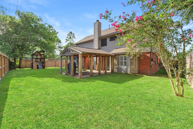 902 Mulberry Ridge Way, Houston, TX 77062 - rear view of property featuring a fenced backyard, a chimney, a gazebo, a shingled roof, and a playground