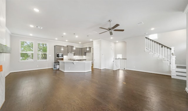 2016 Windsor Meadow Trce, Houston, TX 77051 - unfurnished living room featuring ceiling fan, stairs, dark wood finished floors, recessed lighting, and crown molding