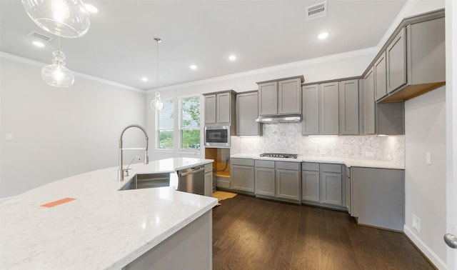 2016 Windsor Meadow Trce, Houston, TX 77051 - kitchen featuring gray cabinetry, stainless steel appliances, dark wood-style flooring, ornamental molding, and recessed lighting