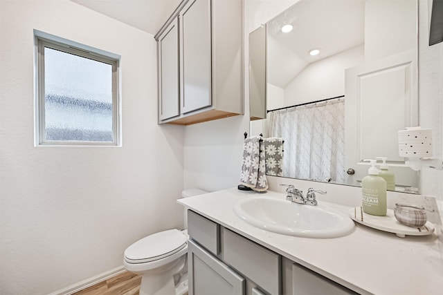19911 Paros Island Dr, Hockley, TX 77447 - bathroom featuring vanity, wood finished floors, vaulted ceiling, curtained shower, and recessed lighting