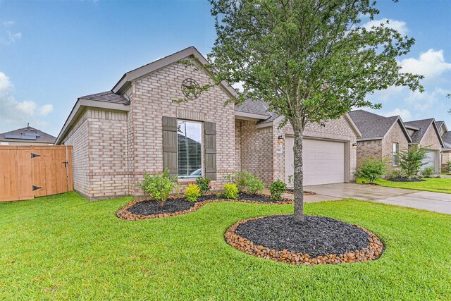 19911 Paros Island Dr, Hockley, TX 77447 - view of front of home featuring brick siding, driveway, an attached garage, roof with shingles, and a gate