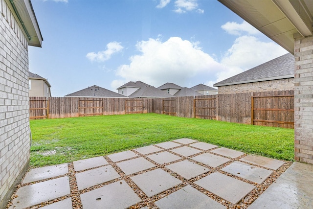 19911 Paros Island Dr, Hockley, TX 77447 - fenced backyard with a patio area