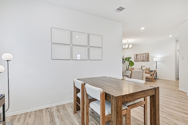 19911 Paros Island Dr, Hockley, TX 77447 - dining room with light wood-style floors, a chandelier, and recessed lighting