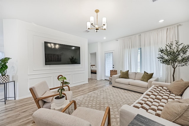 19911 Paros Island Dr, Hockley, TX 77447 - living area featuring a chandelier, light wood-type flooring, and recessed lighting