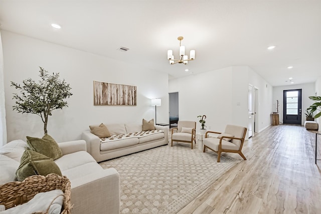 19911 Paros Island Dr, Hockley, TX 77447 - living room with a chandelier, light wood-style flooring, and recessed lighting