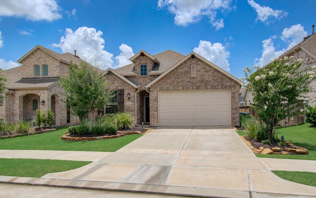 15023 Eves Necklace Ct, Cypress, TX 77433 - view of front of property featuring brick siding, concrete driveway, a shingled roof, a front lawn, and an attached garage